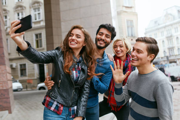 istock People Using Phone Taking Photos On Street, Video Calling 1045282354