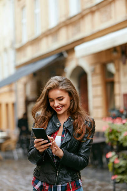 istock Woman Using Phone On Street 1045282610