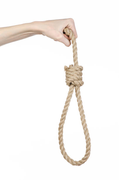 istock Lynching and suicide theme: man's hand holding a loop of rope for hanging on white isolated background 1045282688