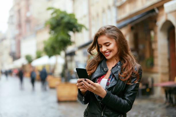 istock Woman Using Phone On Street 1045282738