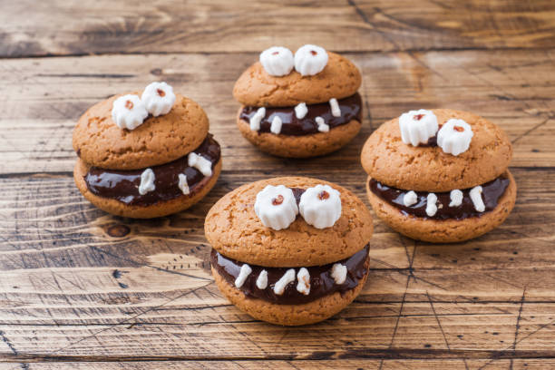 istock Cookies with chocolate paste in the form of monsters for Halloween 1045283536