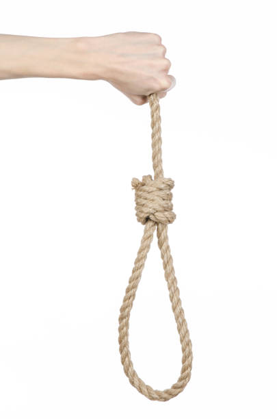 istock Lynching and suicide theme: man's hand holding a loop of rope for hanging on white isolated background 1045283578