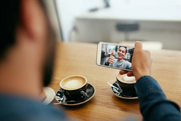 istock Online Video Call. Close Up Man Calling Using Phone 1045283588