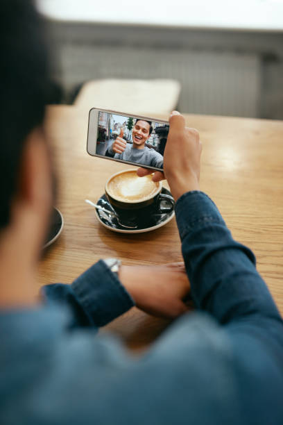 istock Online Video Call. Close Up Man Calling Using Phone 1045283650