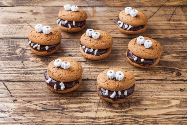 istock Cookies with chocolate paste in the form of monsters for Halloween 1045283952