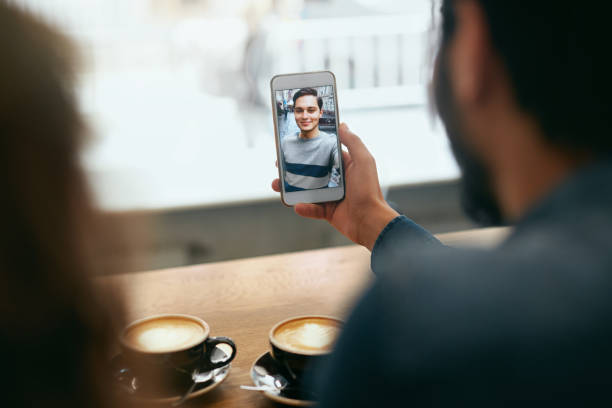 istock Video Calling On Phone. Hand With Phone And Face On Screen 1045286276