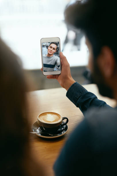 istock Video Calling On Phone. Hand With Phone And Face On Screen 1045286328