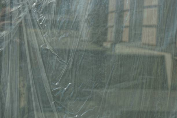 istock gray plastic texture of crumpled cellophane on the wall 1045286382