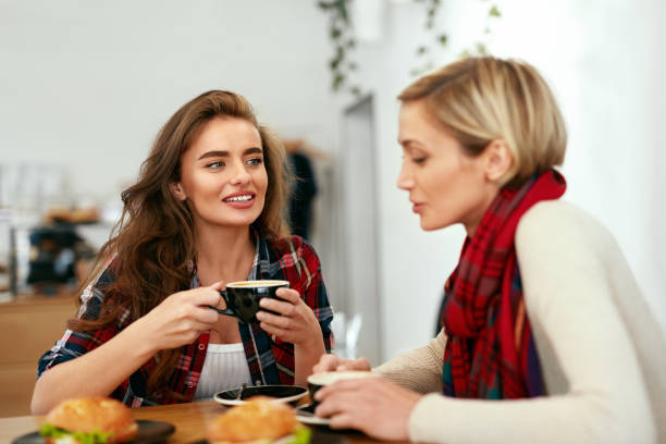 istock Women Friends In Cafe Drinking Coffee 1045286888