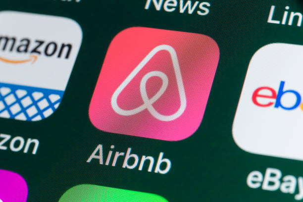 Airbnb, Amazon, ebay, News and other Apps on iPhone screen stock photo