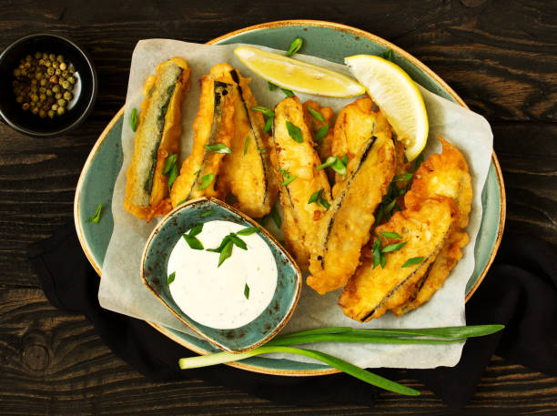 istock Eggplants and zucchini fried in tempura. 1045293702