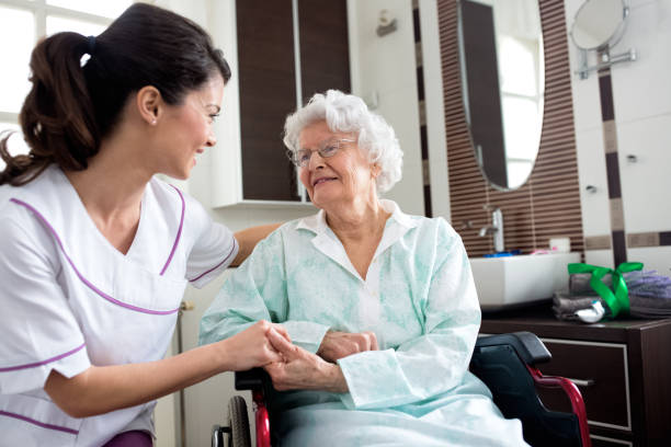 istock Senior old woman with nurse 1045294040