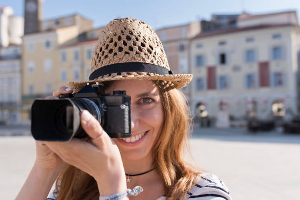 istock Woman taking photo with digital camera 1045297694