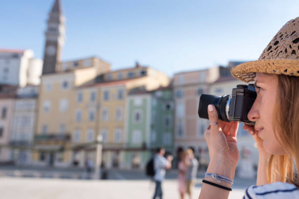 istock Woman taking photo with digital camera 1045297710