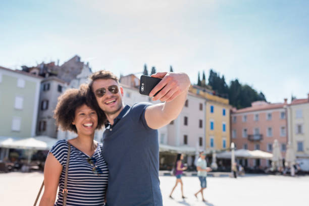 istock Friends taking selfie with smart phone 1045297744