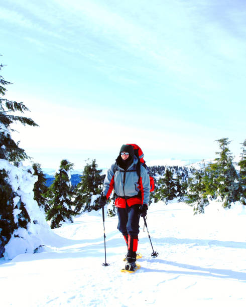 istock Winter hike in the mountains with a backpack and tent. 1045298790