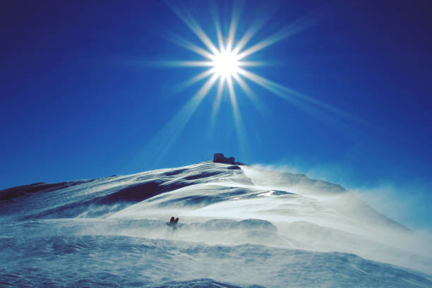 istock Winter hike in the mountains with a backpack and tent. 1045298836