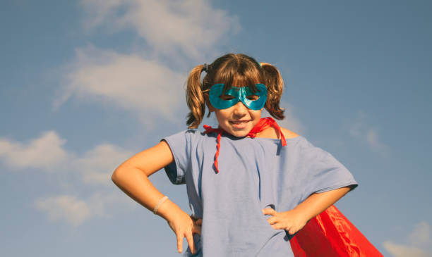 istock Little girl playing superhero 1045302090