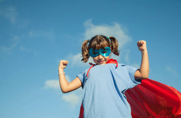 istock Little girl playing superhero 1045302092