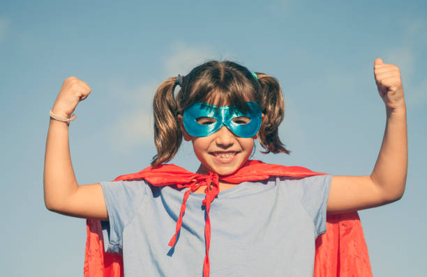 istock Little girl playing superhero 1045302094