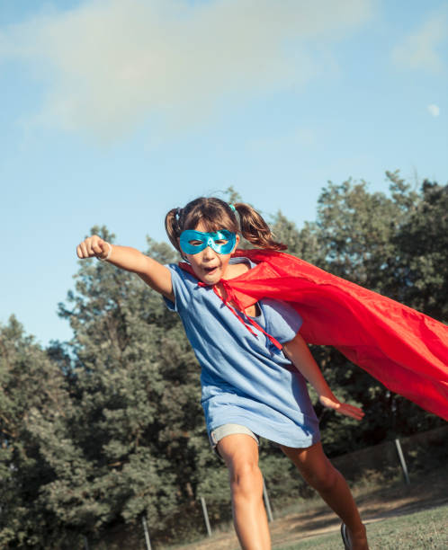 istock Little girl playing superhero 1045302096