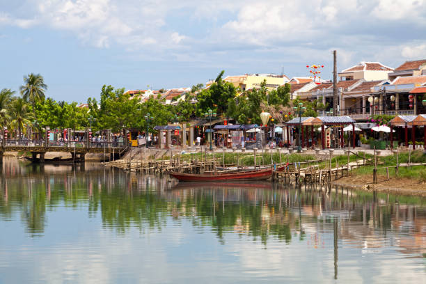 Thu Bon River in Hoi An Hoi An, Vietnam - August 21 2018: Small boat moored on the bank of the Thu Bon River. thu bon river stock pictures, royalty-free photos & images