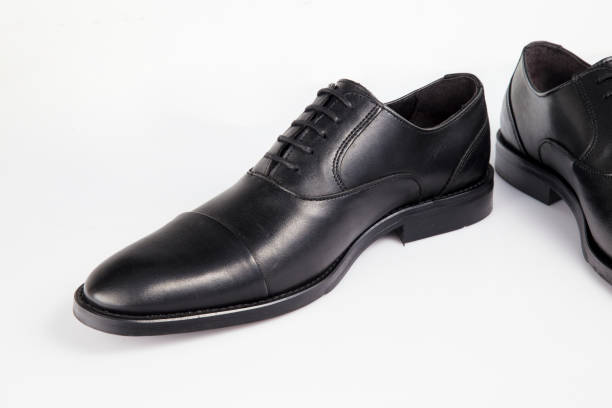 istock Male black leather elegant shoe on white background, isolated product. 1045306494