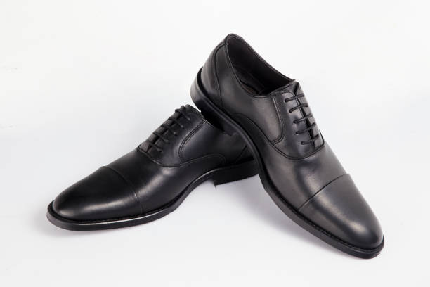 istock Male black leather elegant shoe on white background, isolated product. 1045306764