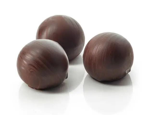 chocolate truffle balls macro isolated on a white background