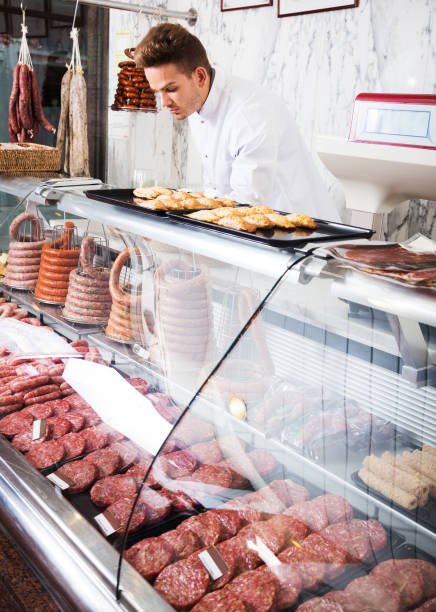 istock Seller in grocery shop 1045322536
