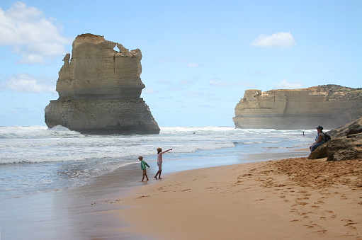 Kids at the beach in Twelve Apostles, Port Campbell National Park, Great Ocean Drive, Victoria, Australia.
