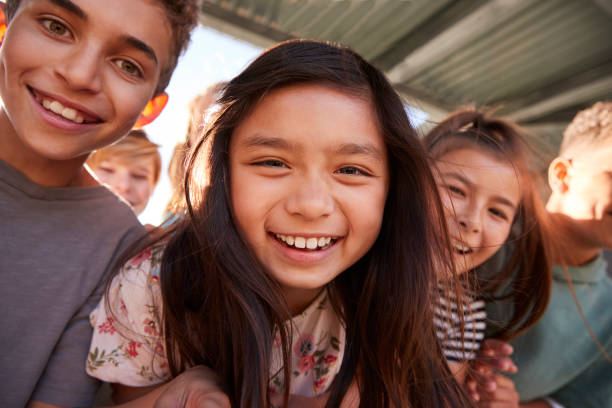 istock Elementary school kids smiling to camera, close up 1045328820