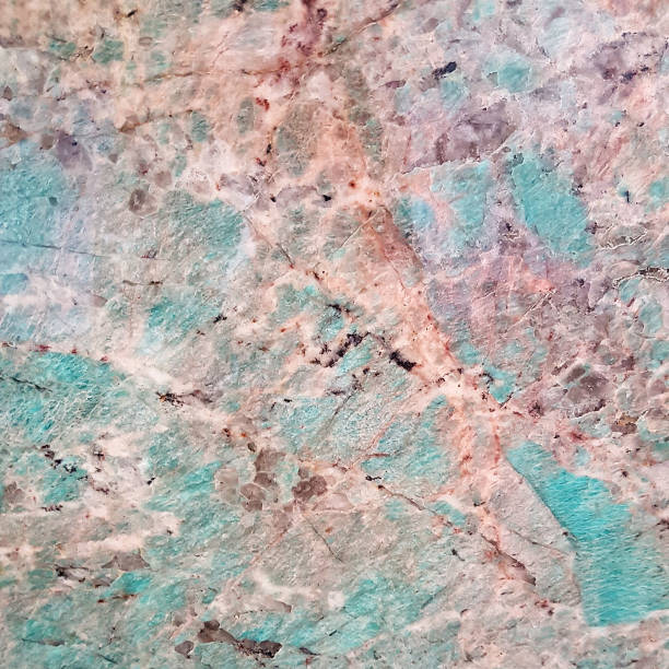 istock Blue, pink and orange cracked marble stone texture 1045331458