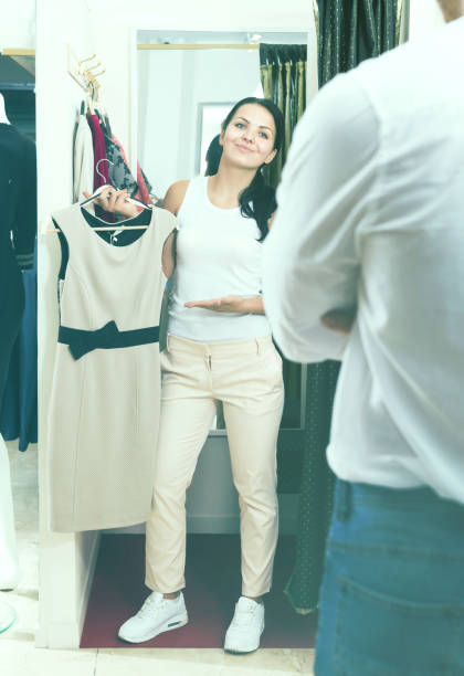 istock Ordinary couple purchasing dress 1045334724
