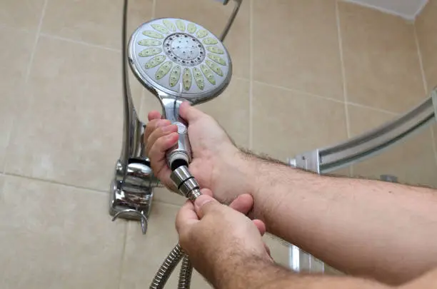 Installing a new shower hose on an used showerhead
