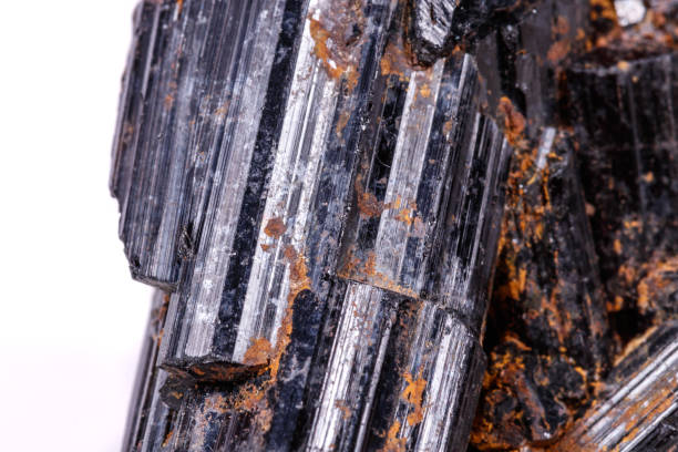 istock macro mineral stone sherle, schorl, black tourmaline on white background 1045335162