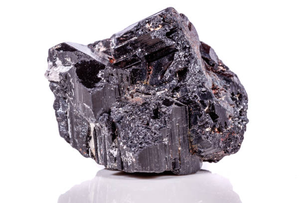 istock macro mineral stone sherle, schorl, black tourmaline on white background 1045335290