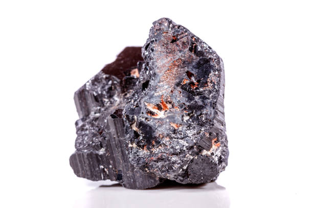 istock macro mineral stone sherle, schorl, black tourmaline on white background 1045335376