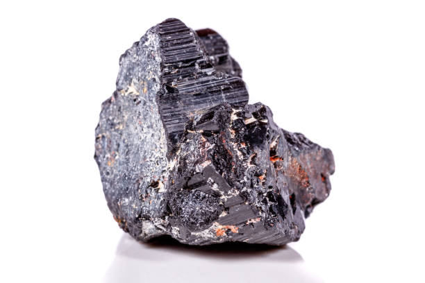 istock macro mineral stone sherle, schorl, black tourmaline on white background 1045335434