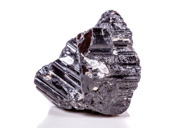 istock macro mineral stone sherle, schorl, black tourmaline on white background 1045335446
