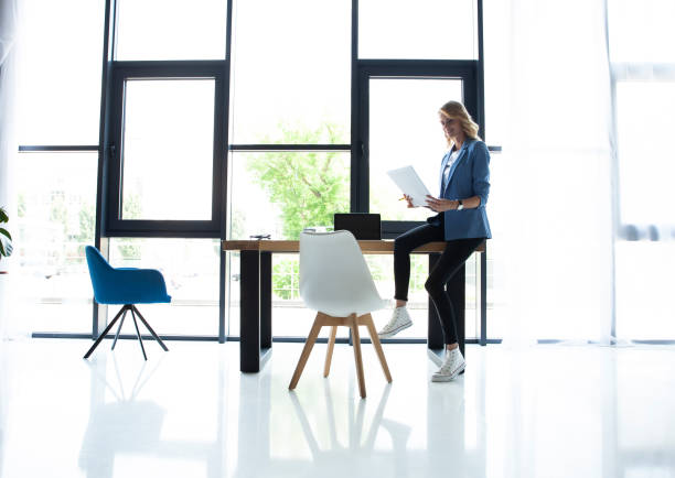 istock Beautiful business lady smiling while working in office 1045336384
