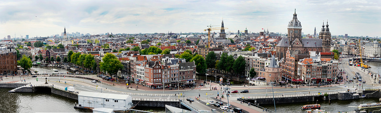A Panoramic view of the Amsterdam Skyline, facing the south direction, featuring the canals, Westerkerk, Royal Palace and the Church of Saint Nicholas
