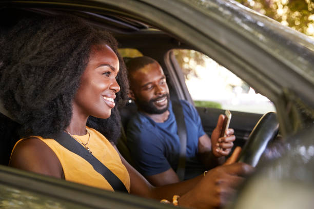 istock A young black man checks smartphone during a road trip 1045343838