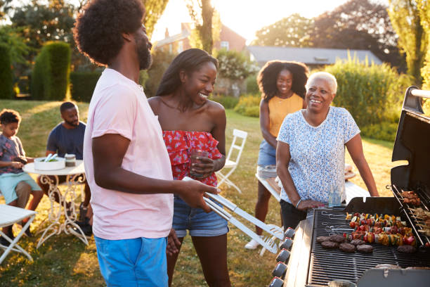 istock Adults talking at a multi generation family barbecue 1045348670