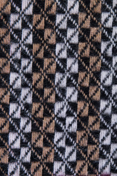 istock Rhombus pattern on woolen fabric. Geometrical ornament on textile 1045351912