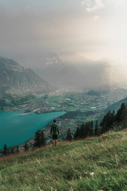 istock Man walking on the mountain ridge in Swiss Alps 1045352532