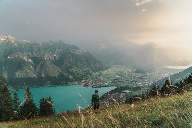 istock Man walking on the mountain ridge in Swiss Alps 1045352534