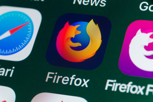 London, UK - July 31, 2018: The buttons of the internet browser app Firefox, surrounded by Safari, Firefox Focus, News and other apps on the screen of an iPhone.