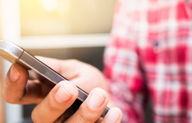 istock Man holding smartphone close up 1045359982
