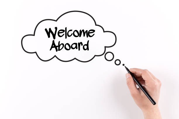 istock Hand writing Welcome Aboard on white paper, View from above 1045361054